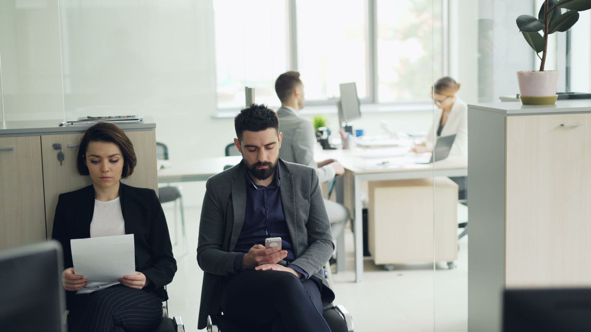 Business people focus on work in a modern open office space. Professional environment.